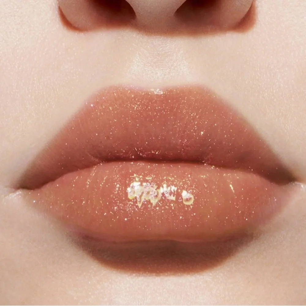 Dior Addict Lip Maximizer Plumping Gloss, likely in the shade 049 Pure Copper